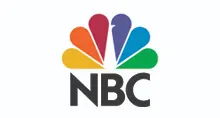 - The official logo for NBC. It features the iconic multi-colored peacock icon with six feathers in yellow, orange, red, purple, blue, and green. Below the peacock, the letters "NBC" are written in a bold, dark grey sans-serif typeface, all set against a solid white background.