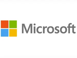 - The official Microsoft logo on a white background, featuring the iconic four-color square symbol (orange, green, blue, and yellow) to the left of the word "Microsoft" in a gray sans-serif font.