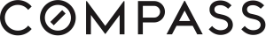 - The official logo for Compass real estate, featuring the word "COMPASS" in a bold, black sans-serif font. The letter "O" is stylized with a diagonal slash through the center to resemble a compass needle